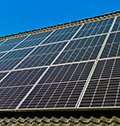 Solar panels capturing sun energy on residential roof